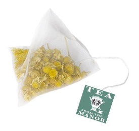 Camomile flower teabag with string and Tea From The Manor label