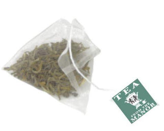 Green tea in pyramid teabag with Tea From The Manor logo